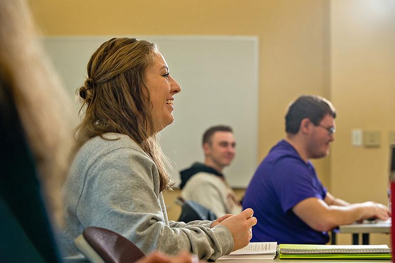 student smiling in class